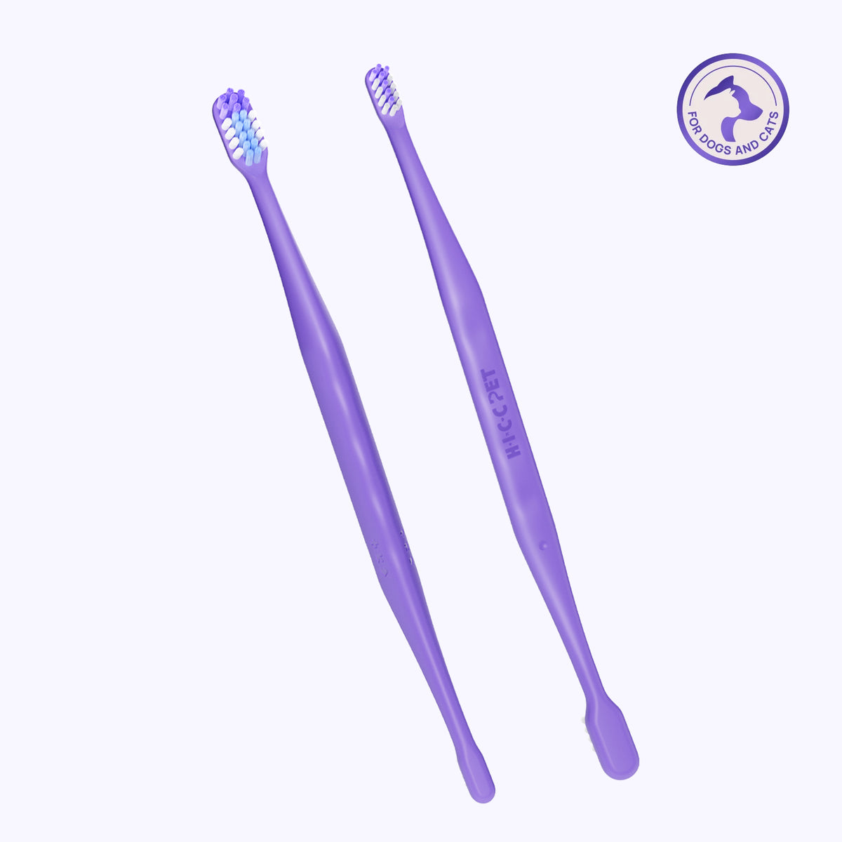 HICC PET dual-head dog toothbrush, two purple brushes crossed on white background - for dogs and cats with large and small brush heads